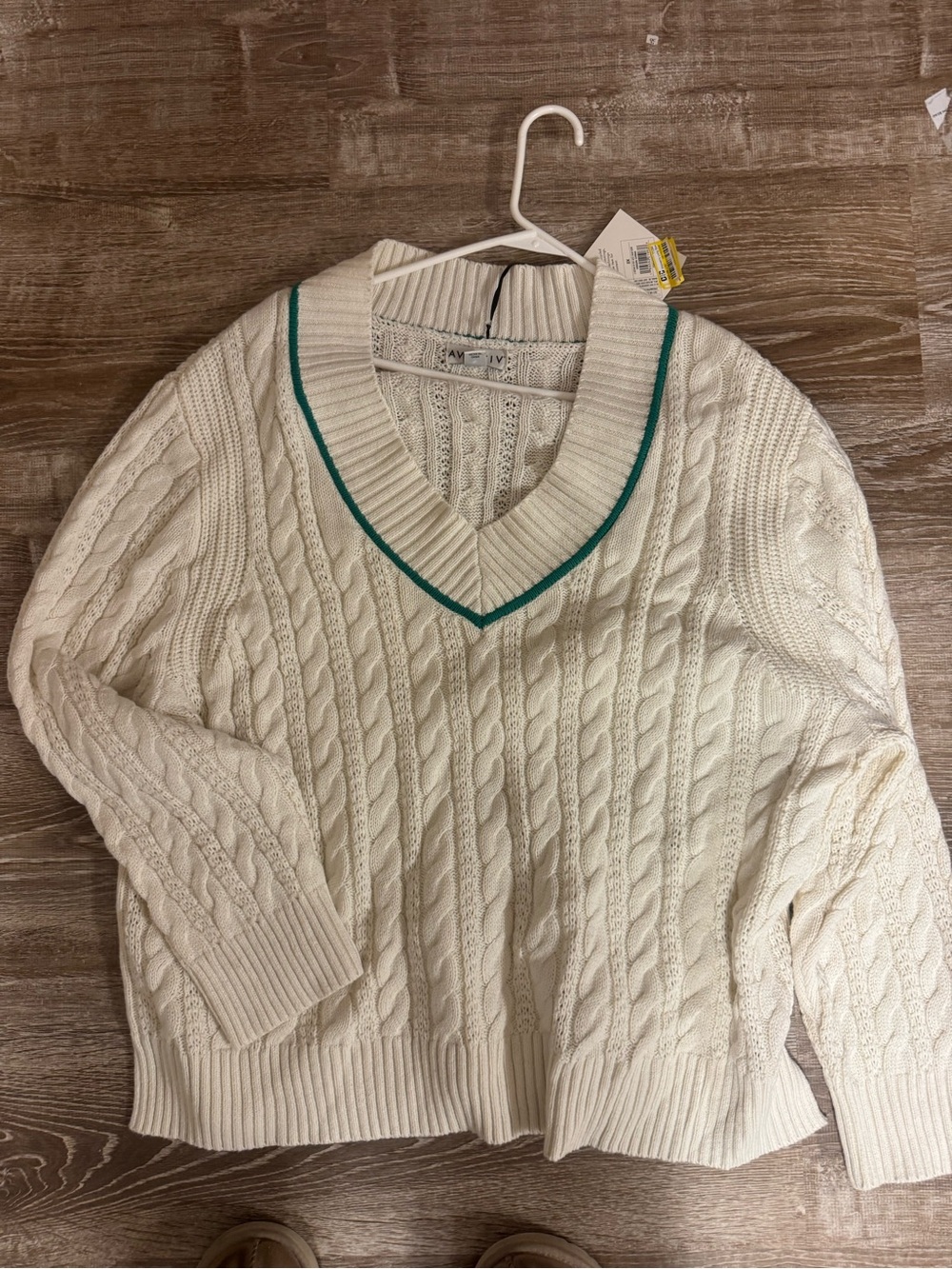 Cream Cable-Knit V-Neck Sweater with Green Trim